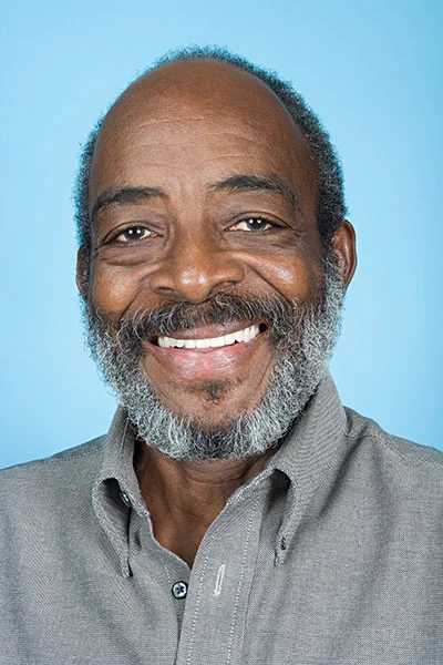 man smiling after getting restorative work done at Ronald Furhmann DDS
