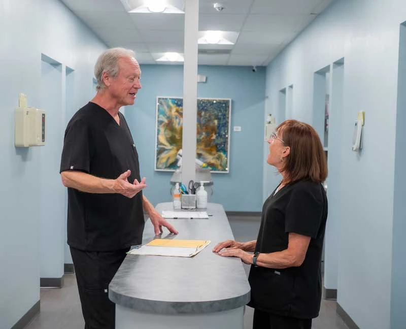 Dentist, Dr Fuhrmann discussing ongoing periodontal treatment options at Ronald Fuhrmann - Virginia Beach VA.